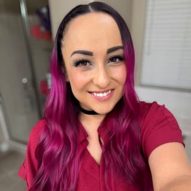 Melissa Hruban, That Reset Girl, smiling, magenta hair.